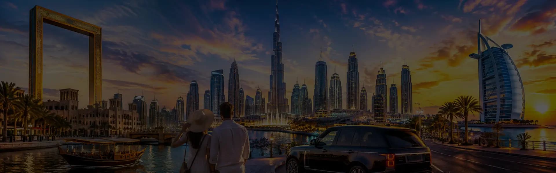 Couple admiring the Dubai skyline and Burj Khalifa at dusk