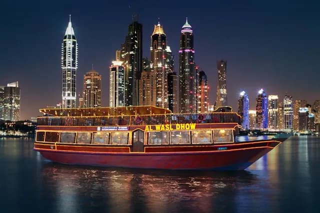 The dhow moored under the Marina towers