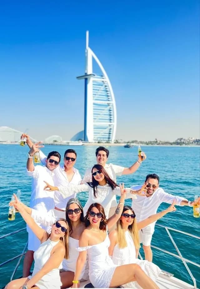 Guests celebrating in front of the Burj Al Arab