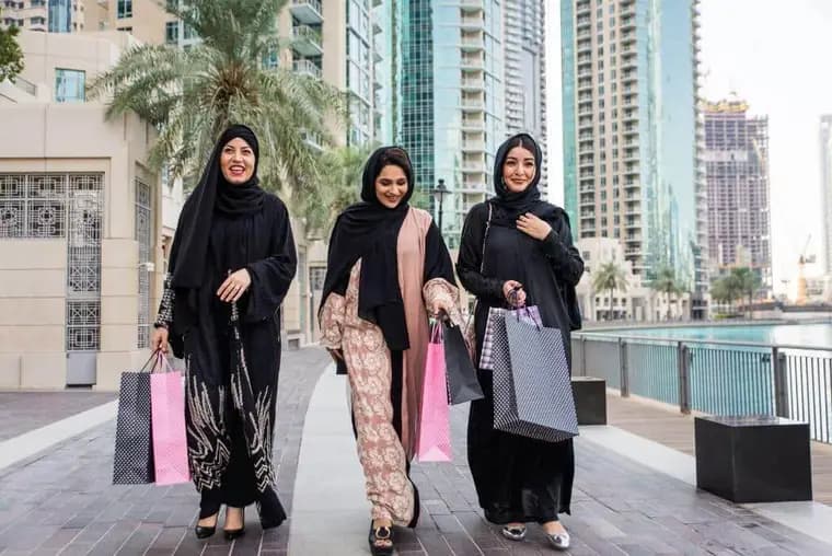 Visitors walking through a Dubai shopping district