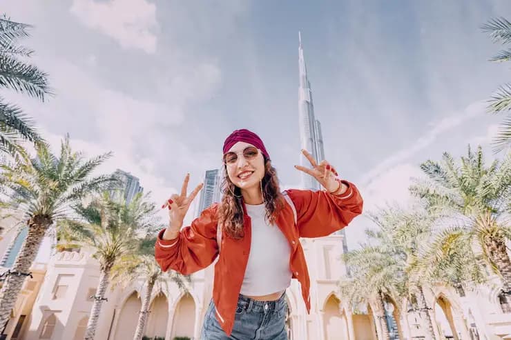 Guest posing among the palms in Dubai