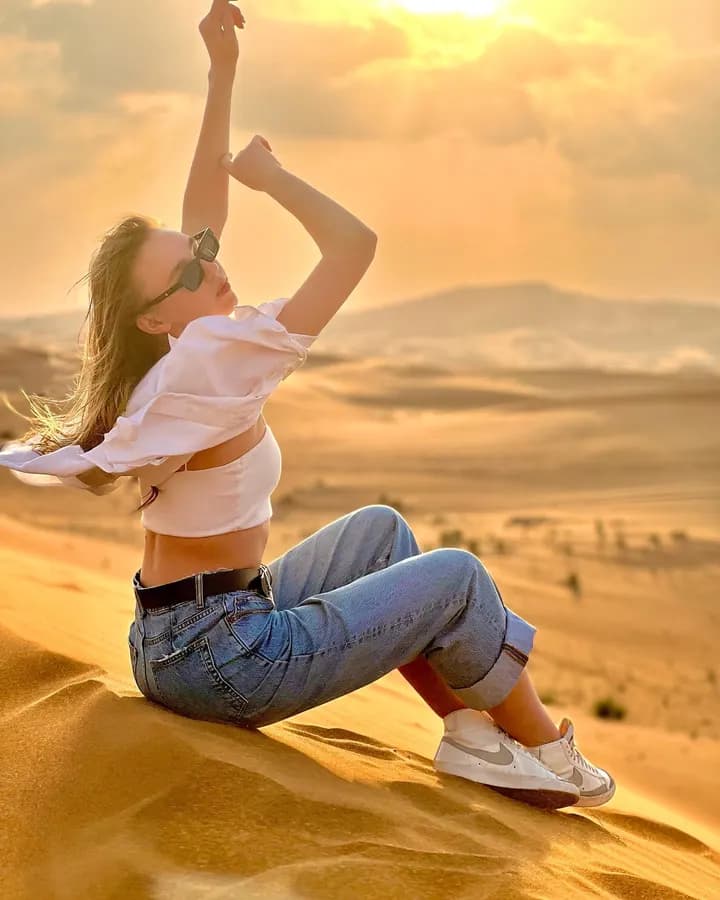 Guest playing with the sand on the dunes