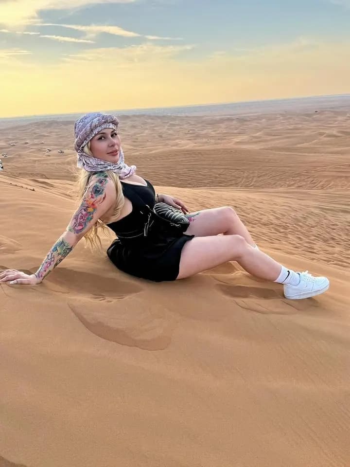 Guest sitting on the dunes