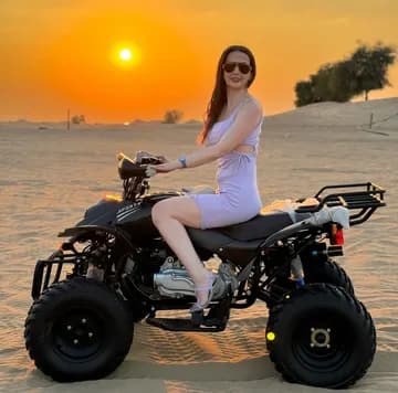 Guest on a quad bike at sunset