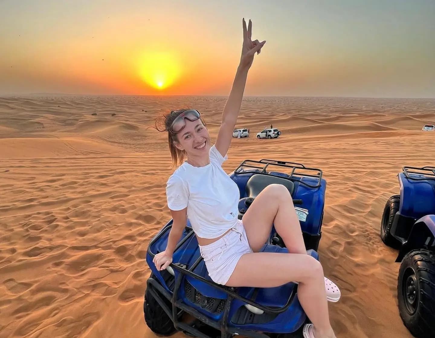 Guest relaxing on a quad bike in the dunes