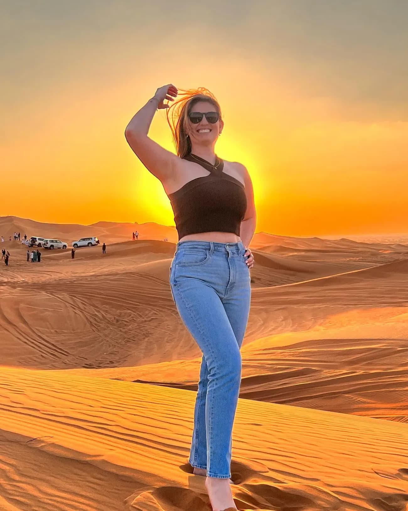Guest enjoying the desert sunset on a premium safari