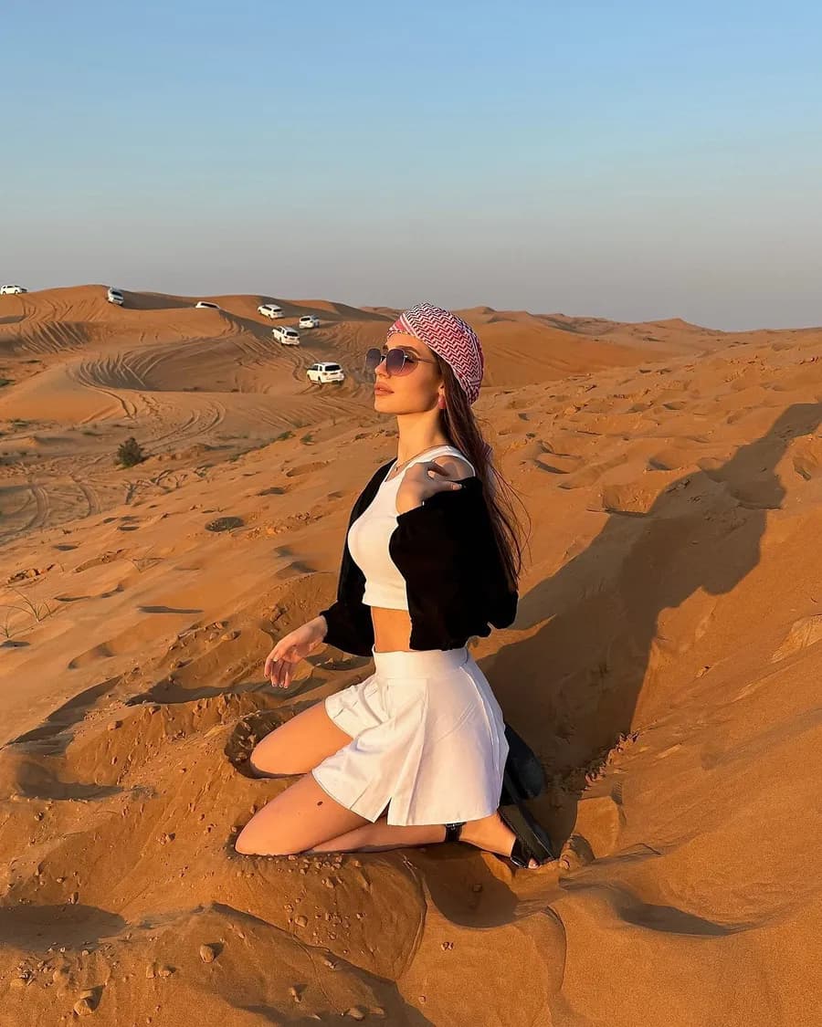 Guest watching the sunset over the dunes