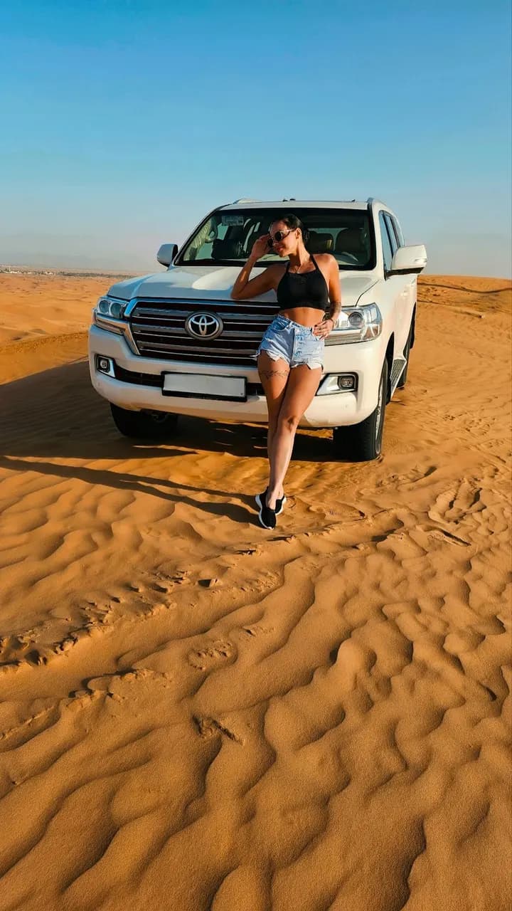 Guest posing beside the private white 4x4