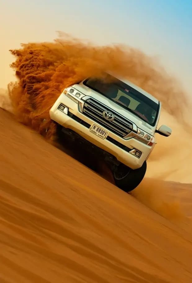 Private 4x4 dune bashing through the red sand
