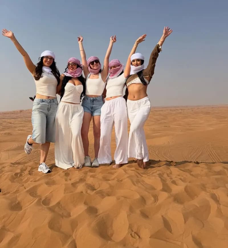 Group of friends celebrating on the dunes