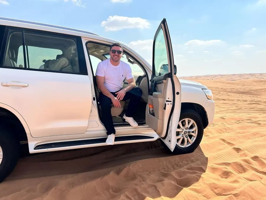 Guest sitting in the doorway of the private 4x4