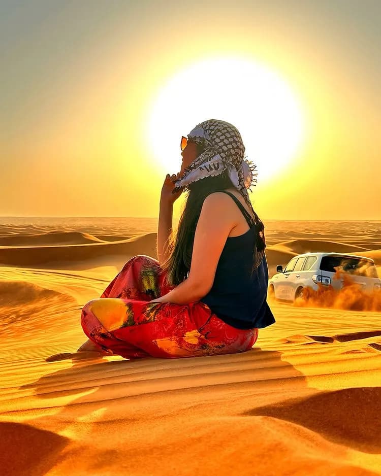 Guest relaxing in the desert at sunset