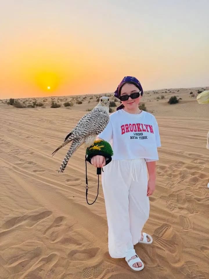 Guest watching the sunset over the dunes