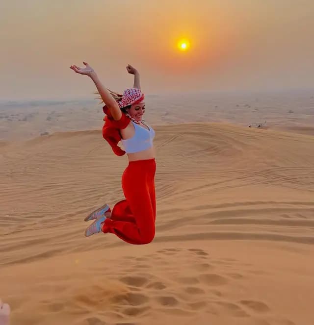 Guest jumping on the dunes at first light