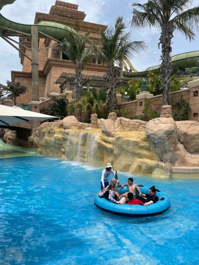 Group on a rapids raft ride under the palms