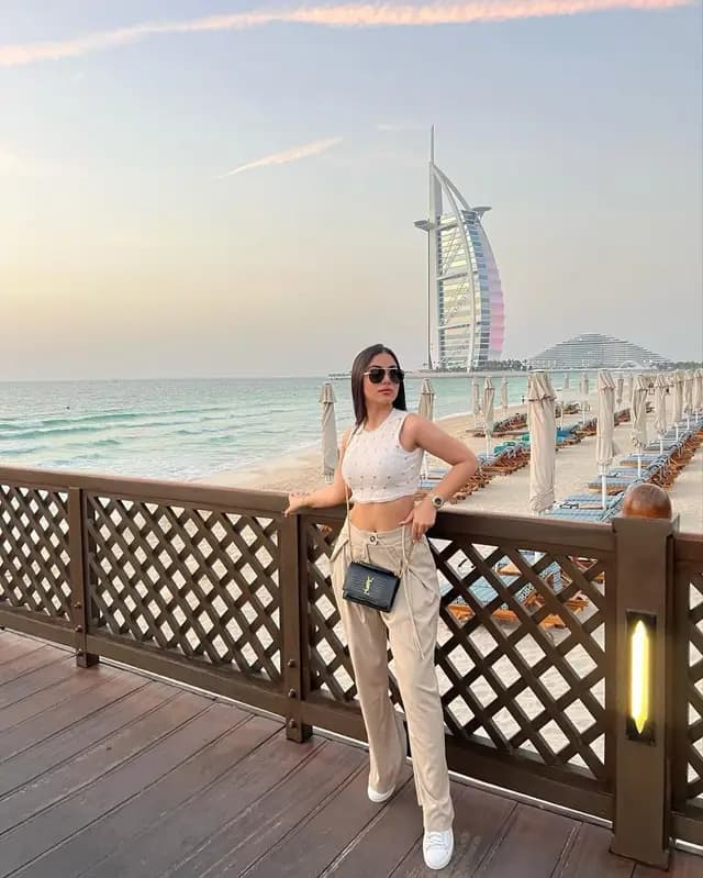 Guest on a boardwalk with Burj Al Arab behind