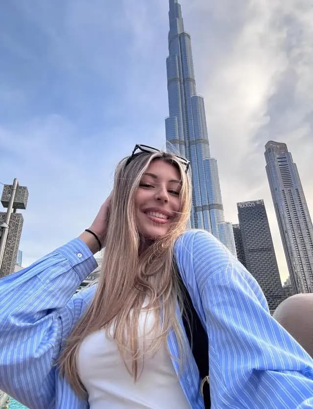 Guest smiling below the Burj Khalifa