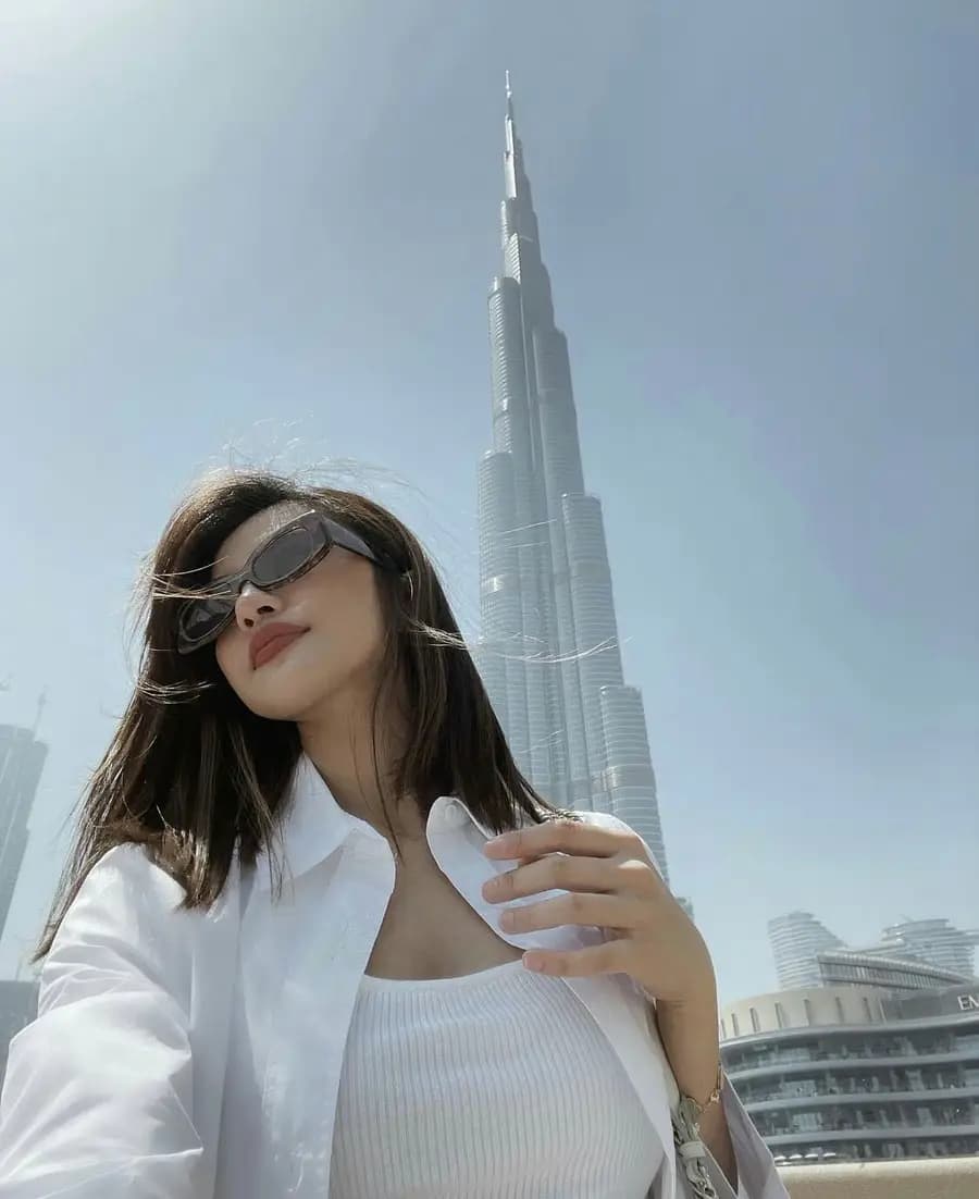 Guest posing with the Burj Khalifa behind