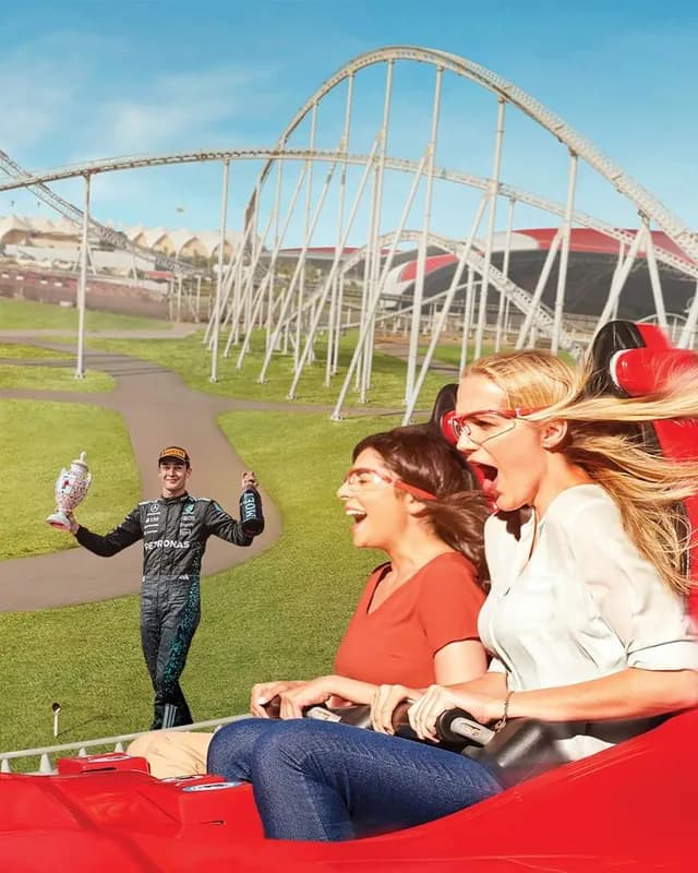 Guests mid-ride on the outdoor coaster