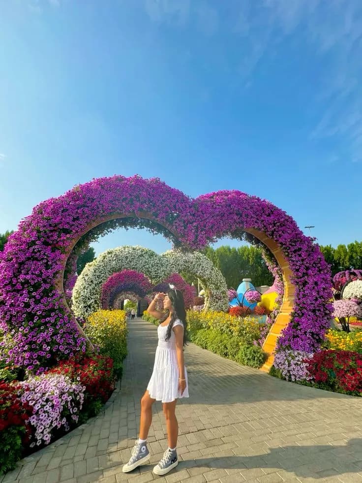 Guest under the purple flower arch walkway