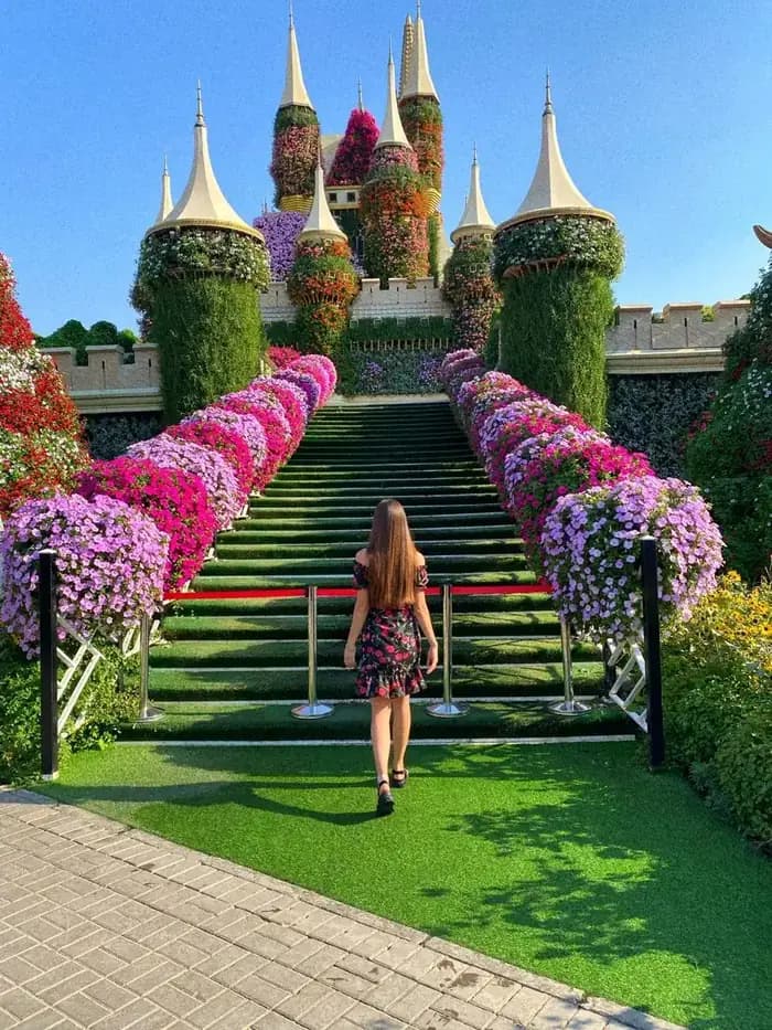 Flower-lined staircase leading to the garden castle