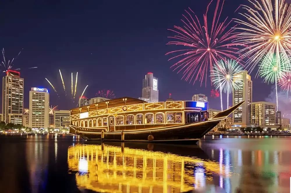Fireworks over the Marina above the lit dhow