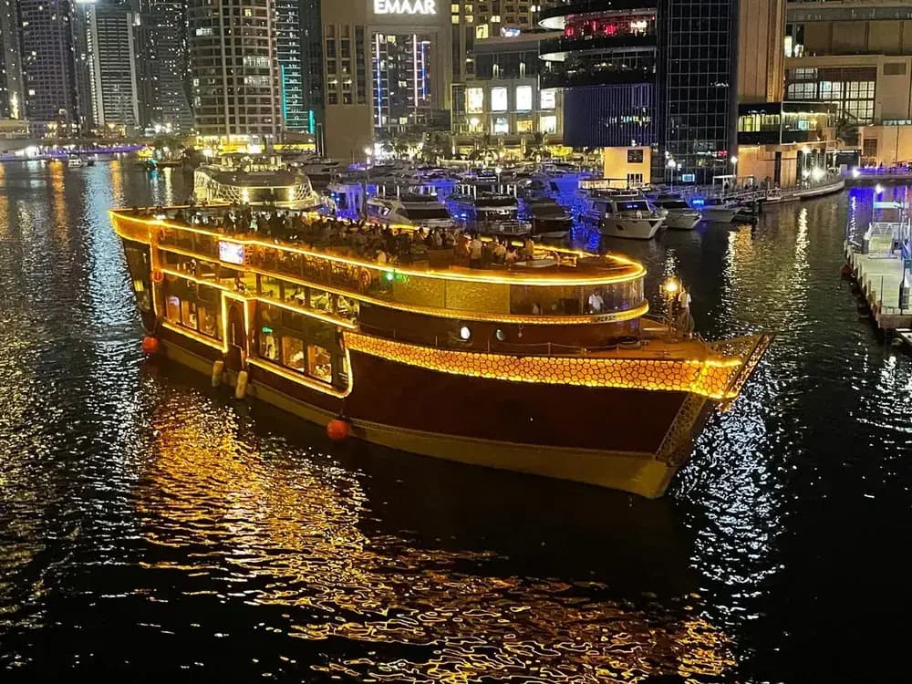 The dinner cruise dhow moored for boarding at night
