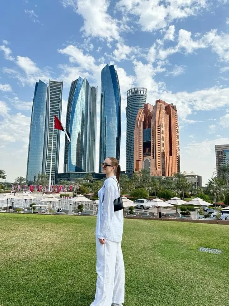 Guest posing in front of the Abu Dhabi towers