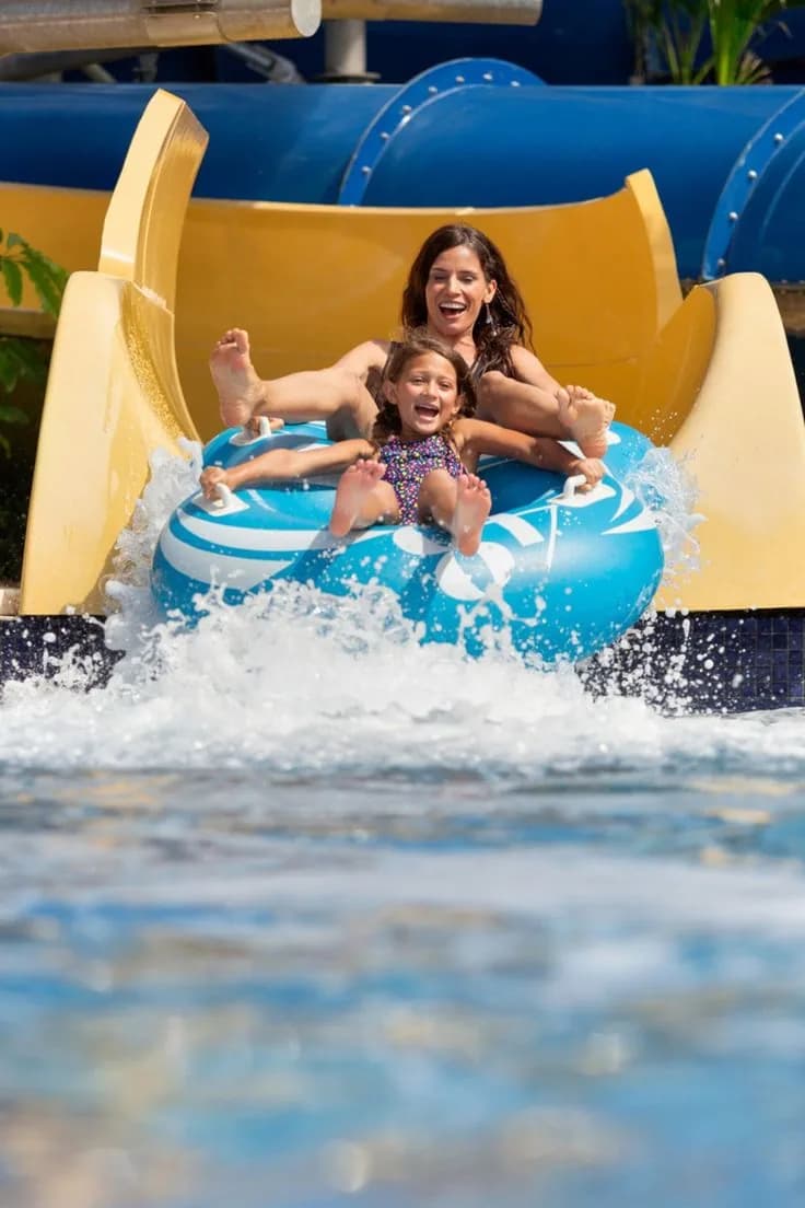 Mother and child landing in the splash pool